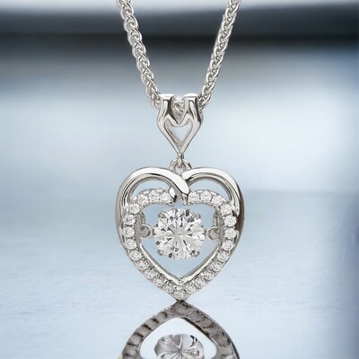 Dancing Stone Heart Pendant Sterling silver Celtic heart pendant reflection