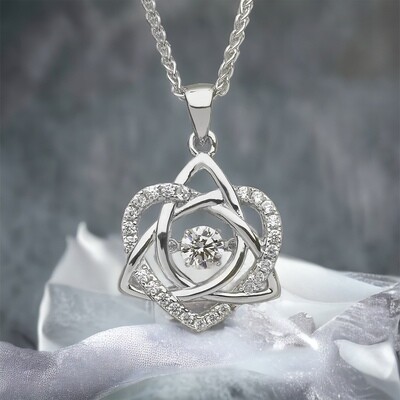 Sterling silver Celtic trinity knot and heart pendant with central dancing CZ stone, handcrafted in Ireland.