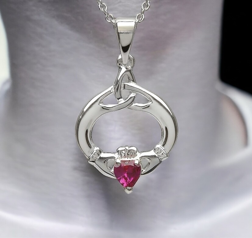 Sterling silver Irish Claddagh pendant necklace with a vibrant colored gemstone, symbolizing love, loyalty, and friendship.