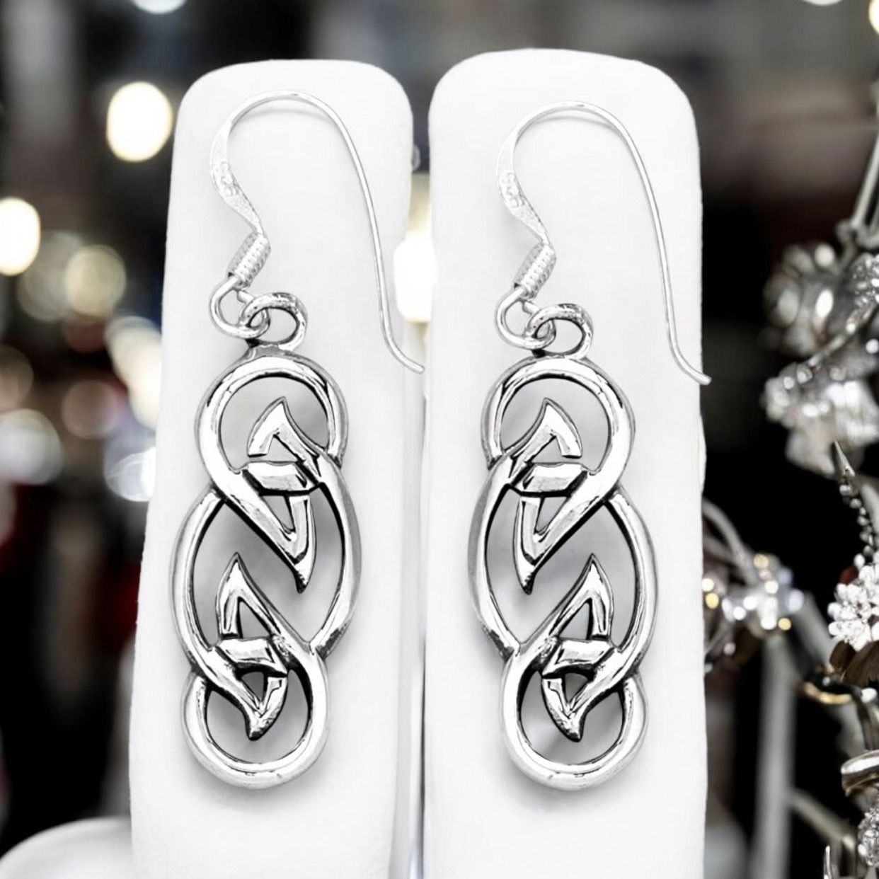Celtic Knot Silver Earrings - Mor Sterling silver Celtic knot weave earrings celebrating timeless Celtic symbolism and heritage. Shown on earrings holder.