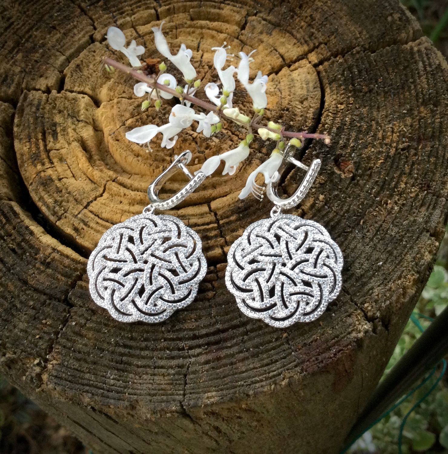 Interlaced Celtic Knot Silver Earrings Sterling silver interlaced Celtic Knot earrings with sparkling cubic zirconia stones, statement Celtic jewelry; on bark.