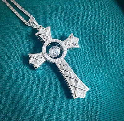 Silver Cross Dancing Stone Pointed High-quality sterling silver cross necklace featuring Celtic knot design and sparkling central CZ stone, perfect gift.