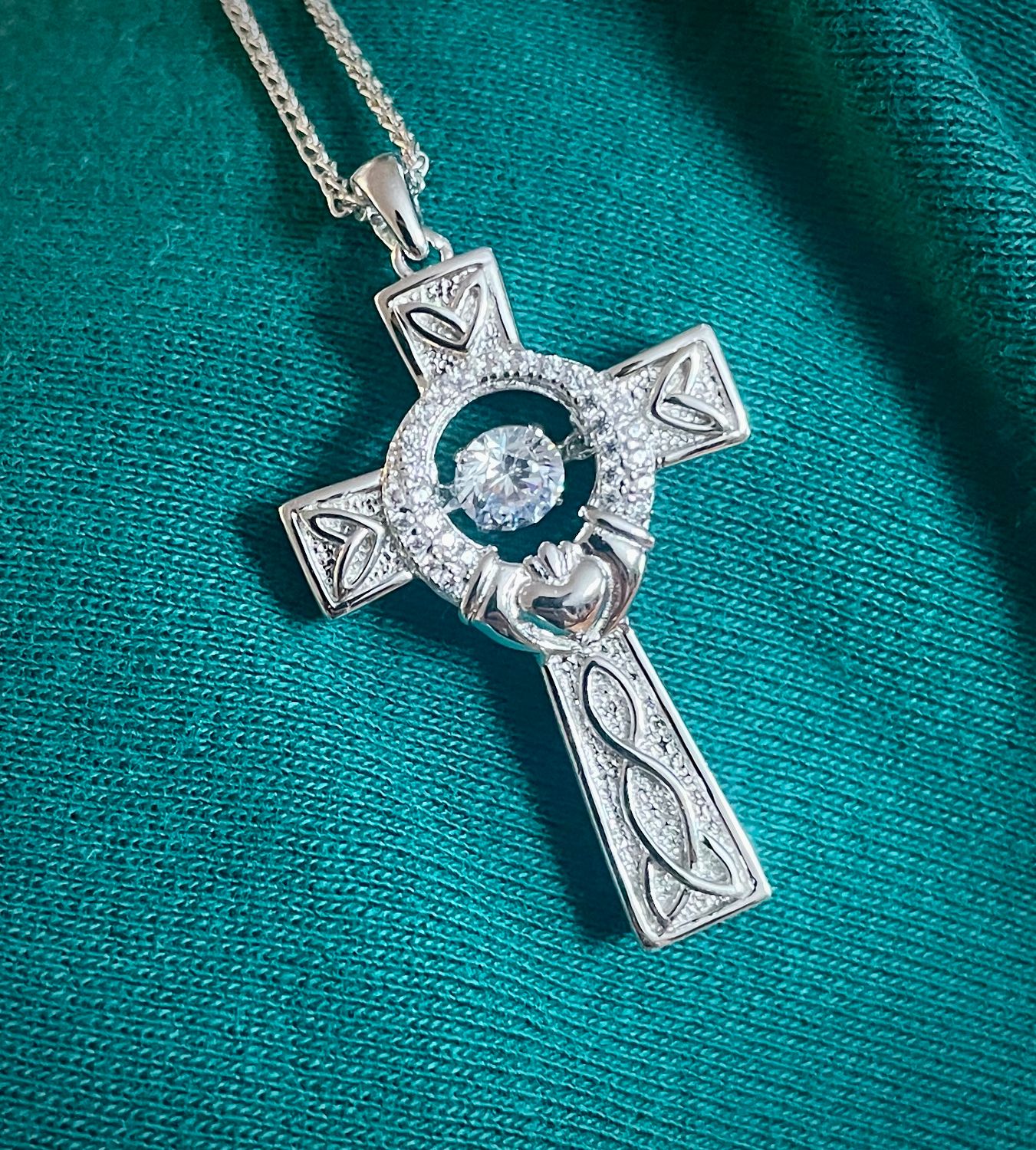 Celtic knot cross necklace made in sterling silver with a sparkling CZ center, ideal Irish gift for heritage lovers.
