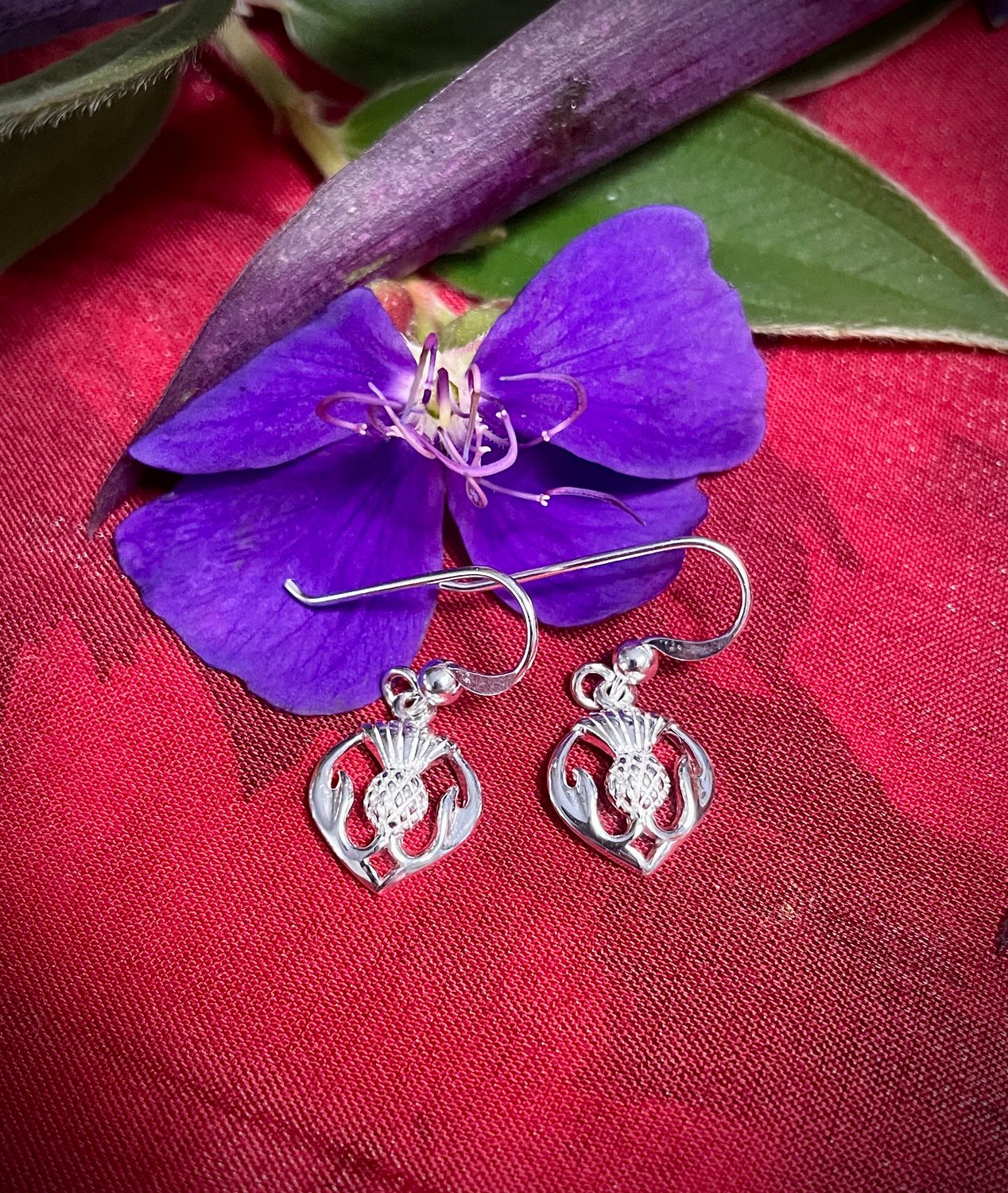Scottish Thistle Earrings Sterling silver Scottish thistle earrings, Celtic jewelry inspired by Scotland’s national flower, shown by purple flower.