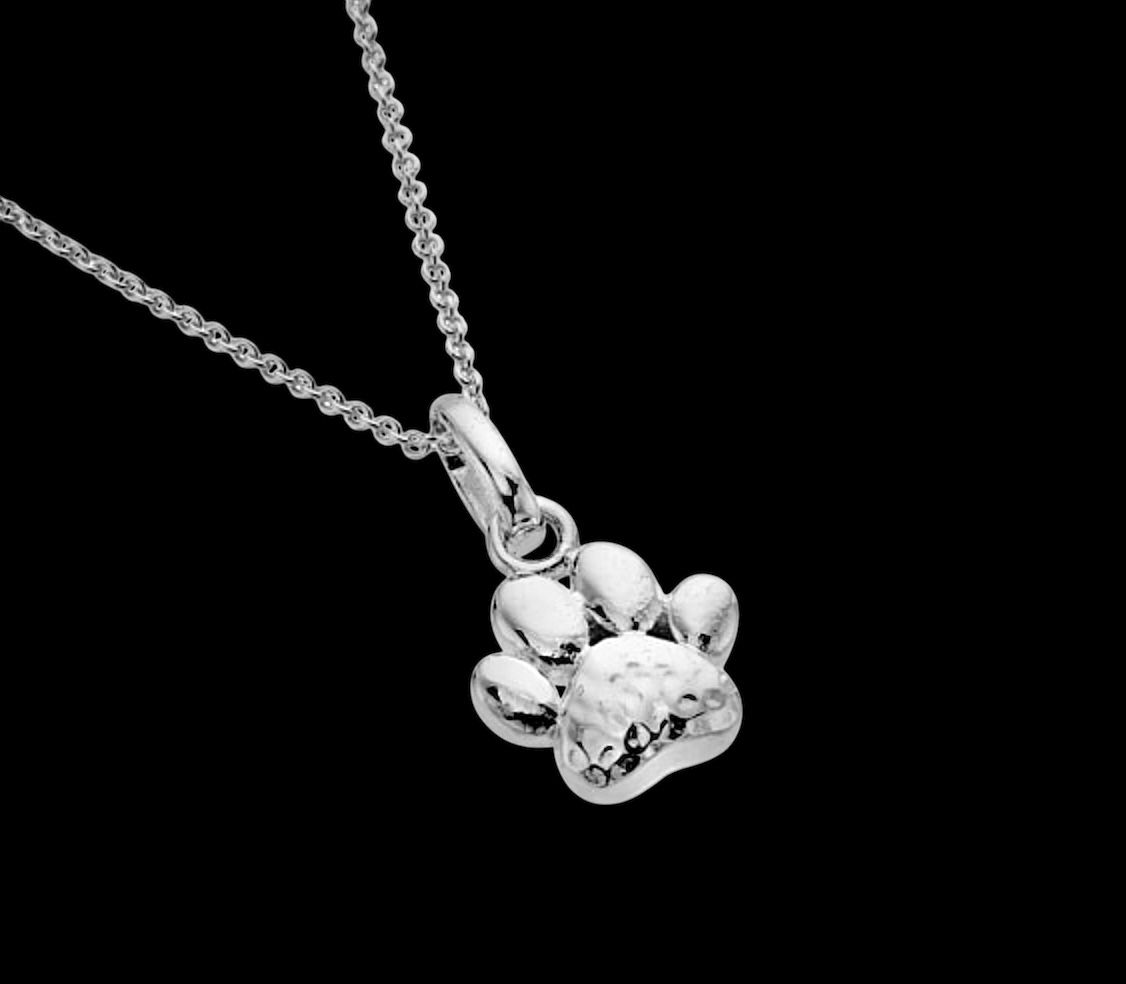 Sterling silver Celtic paw print pendant charm, handcrafted Irish jewelry for animal lovers.