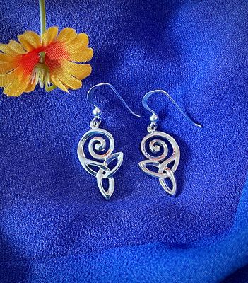 Sterling Silver Celtic Swirl Drop Earrings on Blue Background