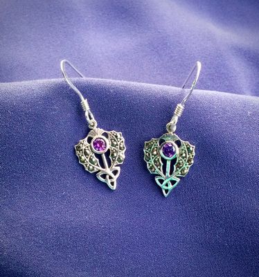Silver and Marcasite Thistle Drop Earrings Sterling silver Scottish thistle drop earrings with trinity knot design and central marcasite stone.