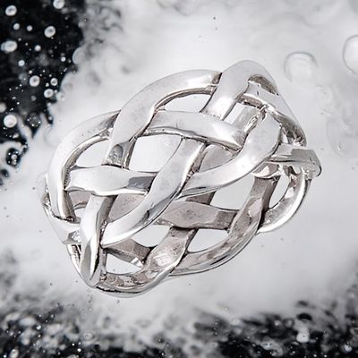 Sterling silver Celtic weave ring with intricate knotwork, elegant and inspired by Celtic heritage. On Water background. 